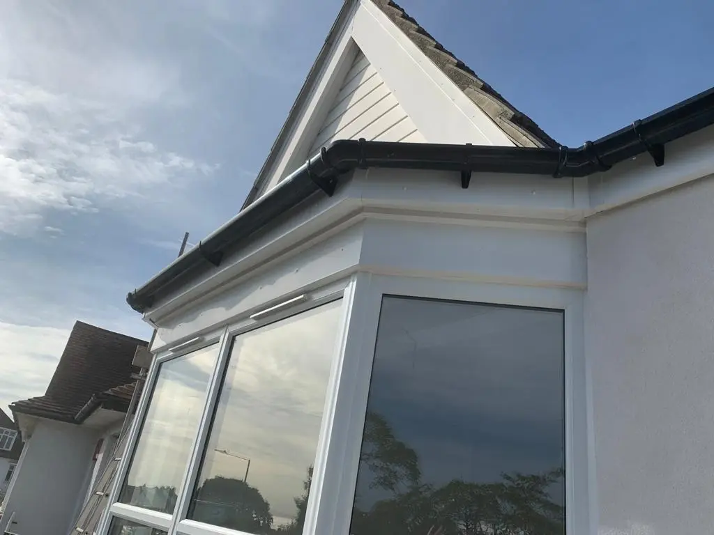 Guttering and rendering combination